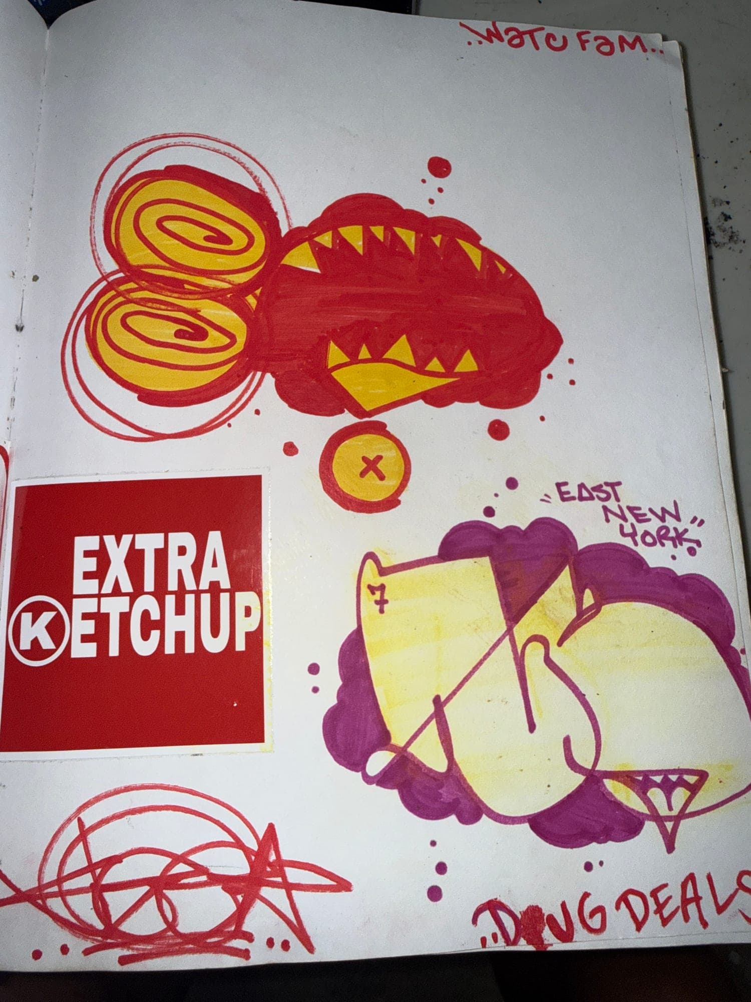 Blackbook page with red, yellow and purple marker pieces around an Extra Ketchup sticker
