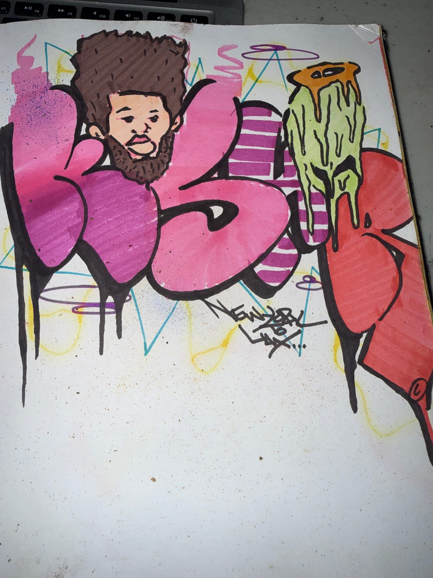Blackbook page of pink and red dripping letters with a drawn portrait sitting on top of the first one